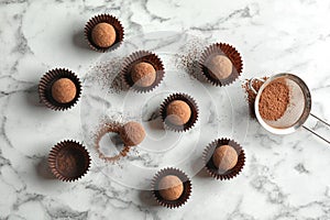 Flat lay composition with tasty raw chocolate truffles