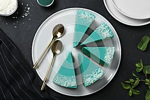 Flat lay composition with tasty spirulina cheesecake on table