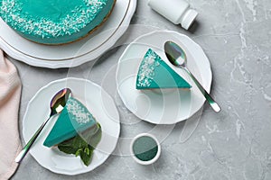 Flat lay composition with tasty spirulina cheesecake