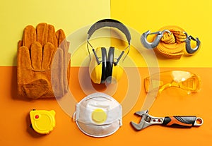 Flat lay composition with tools and safety equipment