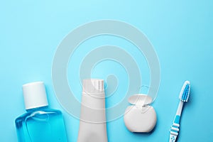 Flat lay composition with toothpaste, oral hygiene products and space for text photo