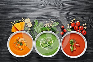 Flat lay composition with various soups and ingredients photo