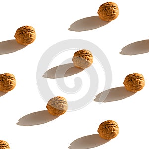 Flat lay composition with walnuts on white background. walnuts pattern.