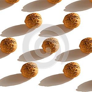 Flat lay composition with walnuts on white background. walnuts pattern.