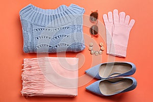 Flat lay composition with warm clothes on background