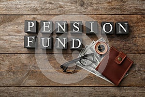 Flat lay composition with words PENSION FUND