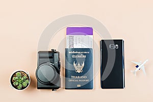 Flat lay and copy space for design work of vintage digital compact camera with Thailand official passport, boarding pass, smart ph