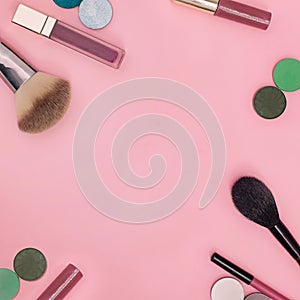 Flat lay of cosmetics on a bright colored background