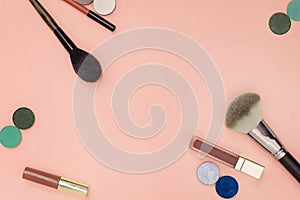 Flat lay of cosmetics on a pastel color background