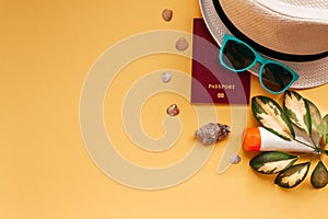 Flat lay covid 19 pandemic travel concept, summer beach holiday accessories on yellow background with copy space