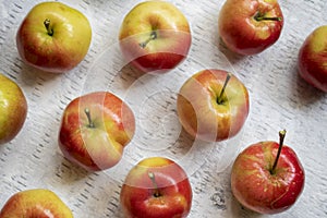 Flat lay of crabapples on a wood background