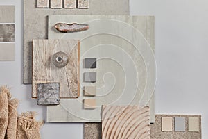 Flat lay of creative architect moodboard composition with samples of building, textile and natural materials and personal. photo