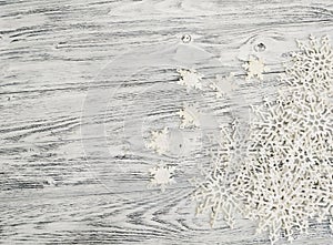 Christmas background - merry christmas. Snowflakes on a wooden background