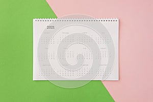 flat lay desk calendar coloured background. High quality photo