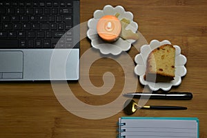 Flat lay with desk laptop and candle