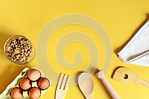 Flat lay with different kitchen and cooking utensils on yellow background. Culinary blog, recipe template, online cooking courses.