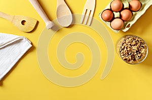 Flat lay with different kitchen and cooking utensils on yellow background. Culinary blog, recipe template, online cooking courses.