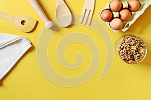 Flat lay with different kitchen and cooking utensils on yellow background. Culinary blog, recipe template, online cooking courses.