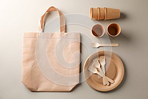 Flat lay with eco - friendly tableware on grey background