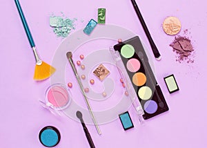Flat lay female cosmetics collage with eye shadows and brushes o