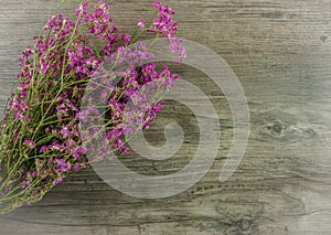 Flat lay flowers on wooden background