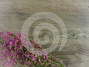 Flat lay flowers on wooden background