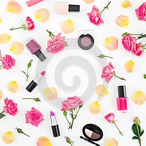 Flat lay frame composition with orange roses flowers and cosmetics on white background