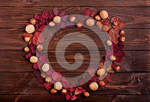 Flat lay frame in the form of a heart of autumn crimson leaves,