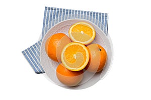 Flat lay of Fresh orange fruit with sliced in plate isolated on white background. Top view with copy space