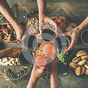 Flat-lay of friends eating and drinking together, top view
