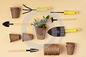 Flat Lay with Garden Tools Gardening Spring or Summer Concept Garden Shovel Rake and Thread are Lying on Yellow Background Top