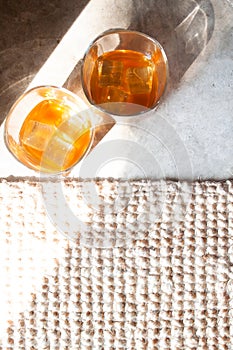 Flat lay glasses of whiskey with ice