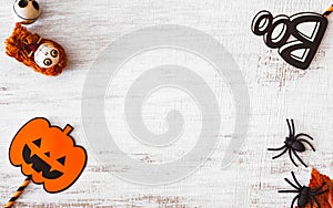 Flat lay Happy Halloween festival background concept. Mix varietyof accessory decoration objects on the grunge rustic white wood.