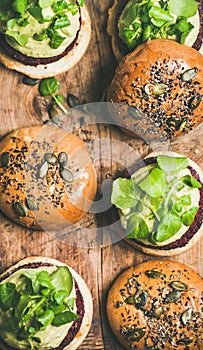 Flat-lay of healthy vegan burgers with beetroot patties, close-up