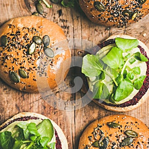 Flat-lay of healthy vegan burgers with beetroot patties, square crop