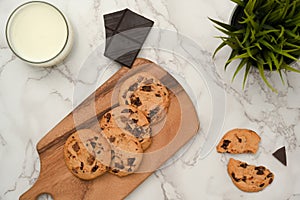 Flat lay, Homemade chocolate chip cookies on a wooden tray