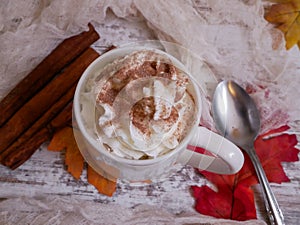 Flat lay of hot chocolate with whipped cream and chocolate sprinkles
