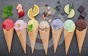 Flat lay ice cream cones collection on dark stone background . Blank crispy ice cream cone with copy space for sweets menu design