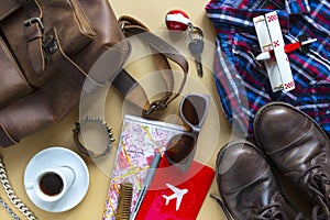 Flat lay image of brown leather accessory man to plan travel in holiday background concept. camel color background
