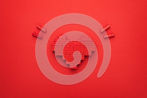 Flat lay image of like button on red background