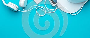 Flat lay image of modern teenager accessories on blue background with copy space