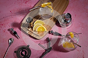 Flat lay image of two gin tonics with cocktail props