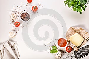 Flat lay ingredients for making pizza or pasta. Traditional Italian cuisine. Tomato sauce, mushrooms, spices, Parmesan cheese and