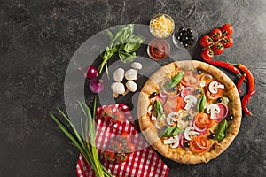 flat lay with italian pizza and fresh ingredients