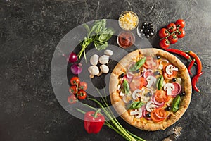 flat lay with italian pizza and fresh ingredients