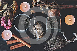 Flat lay of kitchen witchery using herbs and spices found at home. Herbal magick in wicca and witchcraft.