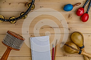 Flat lay of Latin percussion on wood desk