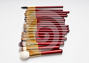 Flat lay. Makeup brushes on white background. top view