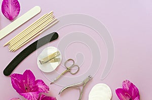 Flat lay of manicure accessories with flowers