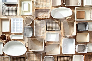 Flat lay of Marie Kondo`s storage boxes, containers and baskets with different sizes and shapes